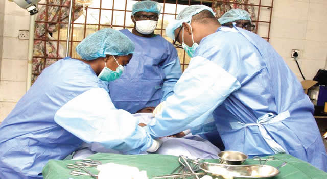 Some doctors performing a surgery